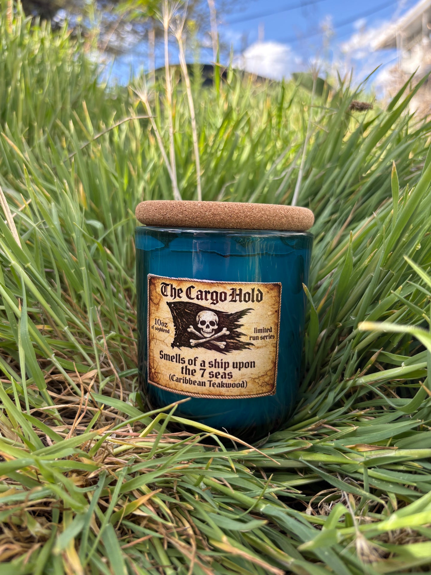 The Cargo Hold - Caribbean Teakwood Candle in grass